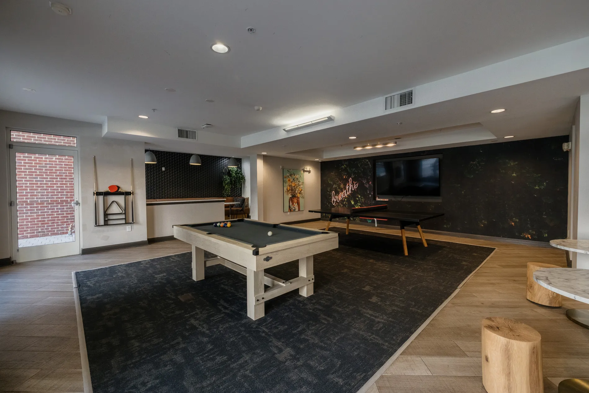 Game room with a pool table and a ping pong table